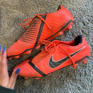 Men’s orange Nike cleats size 10.5
